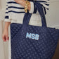 Personalized quilted tote combining practicality and style. Features a unique quilted design and customizable personalization, making it a one-of-a-kind accessory for any occasion. Stay organized and chic with this must-have tote