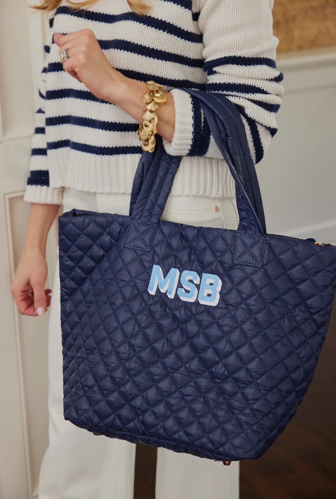 Personalized quilted tote combining practicality and style. Features a unique quilted design and customizable personalization, making it a one-of-a-kind accessory for any occasion. Stay organized and chic with this must-have tote