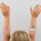 Unicorn and rainbow-themed temporary tattoos with candy-like colors, gold, and holographic silver foil. Illustrated by Hello!Lucky for Daydream Society. Pack includes 2 tattoos (1 of each design), each measuring 2.5 inches square. Safe, non-toxic, and packaged in a card stock envelope