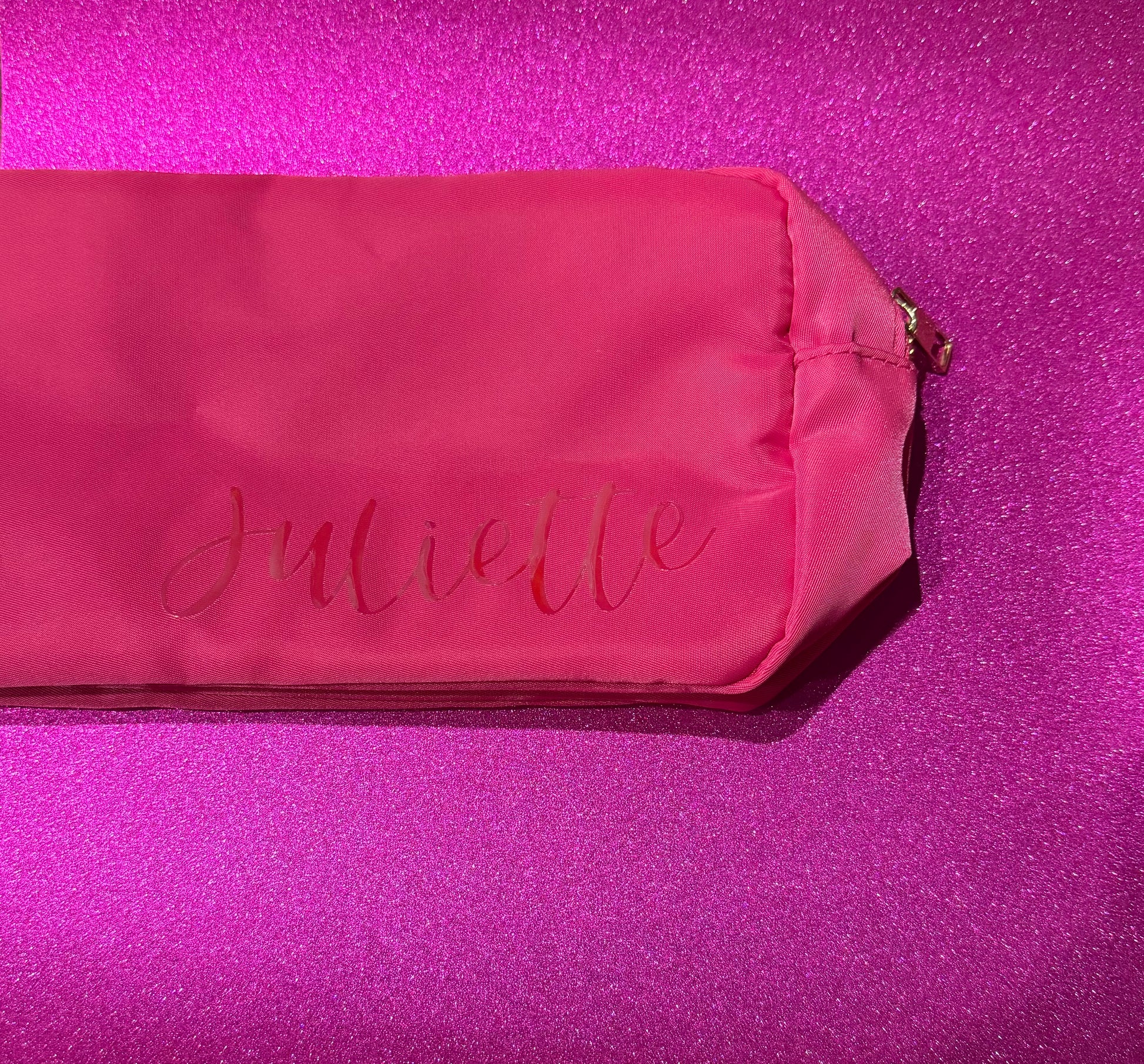 Personalized cosmetic pouch with zipper, featuring custom name, initials, or trendy icons. Lightweight and durable, available in neon or neutral colors with gold zippers. Size: 10" long x 5" wide x 3" deep. Perfect for summer slumber parties, travel, school, or as a makeup organizer. Great gift for girls, bridesmaids, or team members.