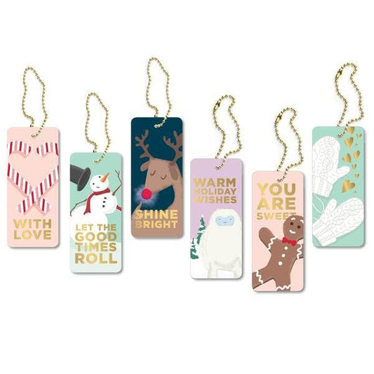 Assorted Set of Six Laminated Holiday Tags with Gold-Foil Lettering, Featuring Yeti, Gingerbread Man, Mittens, Candy Canes, Snowman, and Reindeer Designs, Includes Golden Ball-Chain for Easy Attachment.