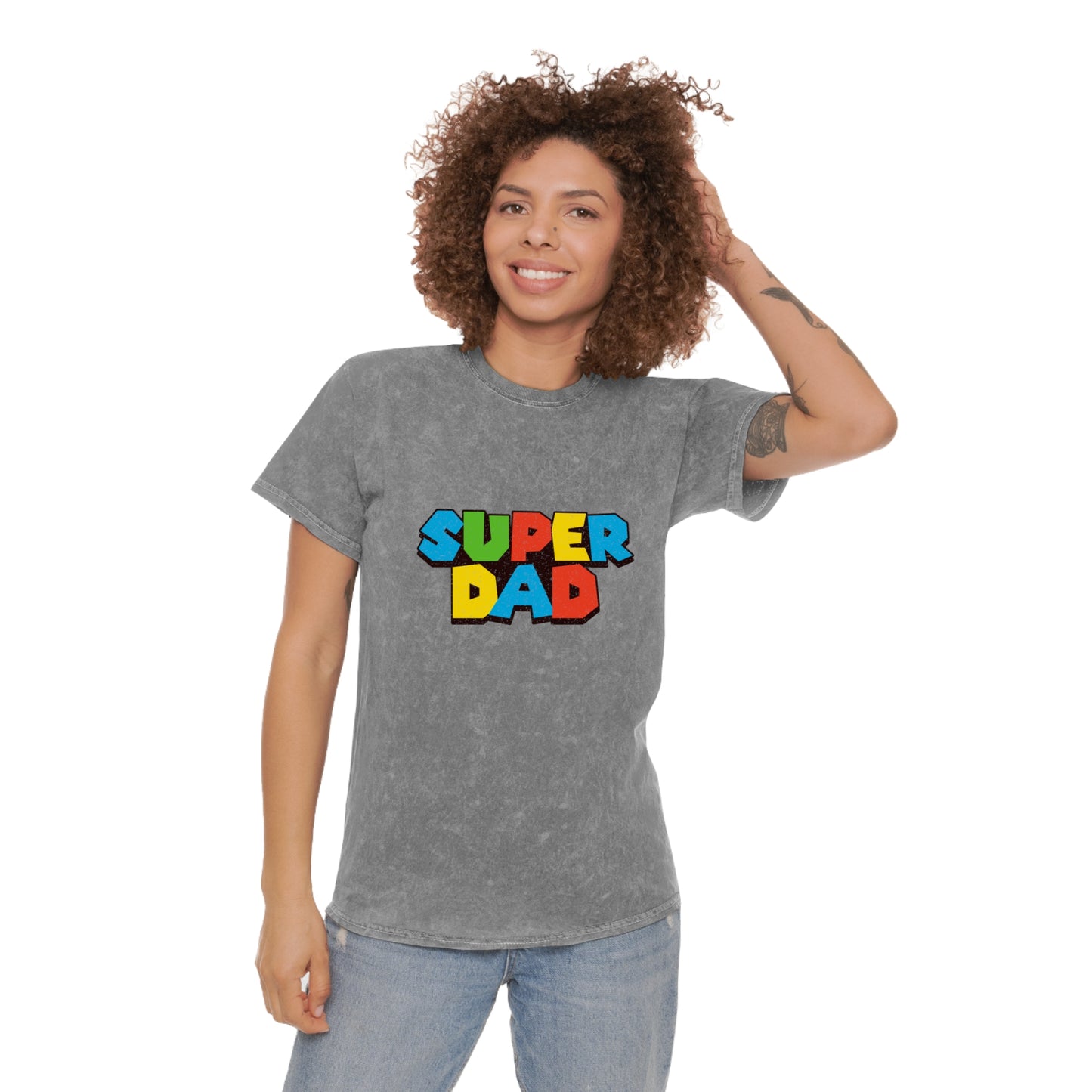 Super Mario-inspired retro 80s Father’s Day shirt for gamer dads. Soft 100% cotton with a nostalgic mineral wash effect, featuring a classic crewneck and 'SUPER DAD' graphic in colorful block letters. Available in black, gray, navy, and purple, men’s sizes small to 2XL. Perfect geeky dad gift for birthdays or Father’s Day.