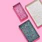 Add sparkle to your home or office with this 12x8 acrylic confetti tray, featuring a 2-inch height and pearl confetti mix. Perfect for guest bathrooms, coffee tables, or as a stylish desk tray. Elevate your decor with this imported, elegant accessory