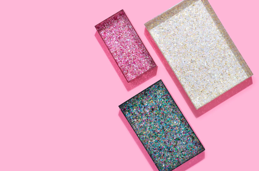 Add sparkle to your home or office with this 12x8 acrylic confetti tray, featuring a 2-inch height and pearl confetti mix. Perfect for guest bathrooms, coffee tables, or as a stylish desk tray. Elevate your decor with this imported, elegant accessory