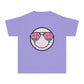 Kids’ summer t-shirt with a leopard print smiley face and watermelon sunglasses. Soft, durable cotton, available in youth sizes XS-XL. Perfect for summer activities.