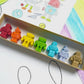 Eco-friendly Robot Crayons made from recycled and upcycled materials, packaged in a stylish box. Great for parties, classrooms, or as unique gifts.