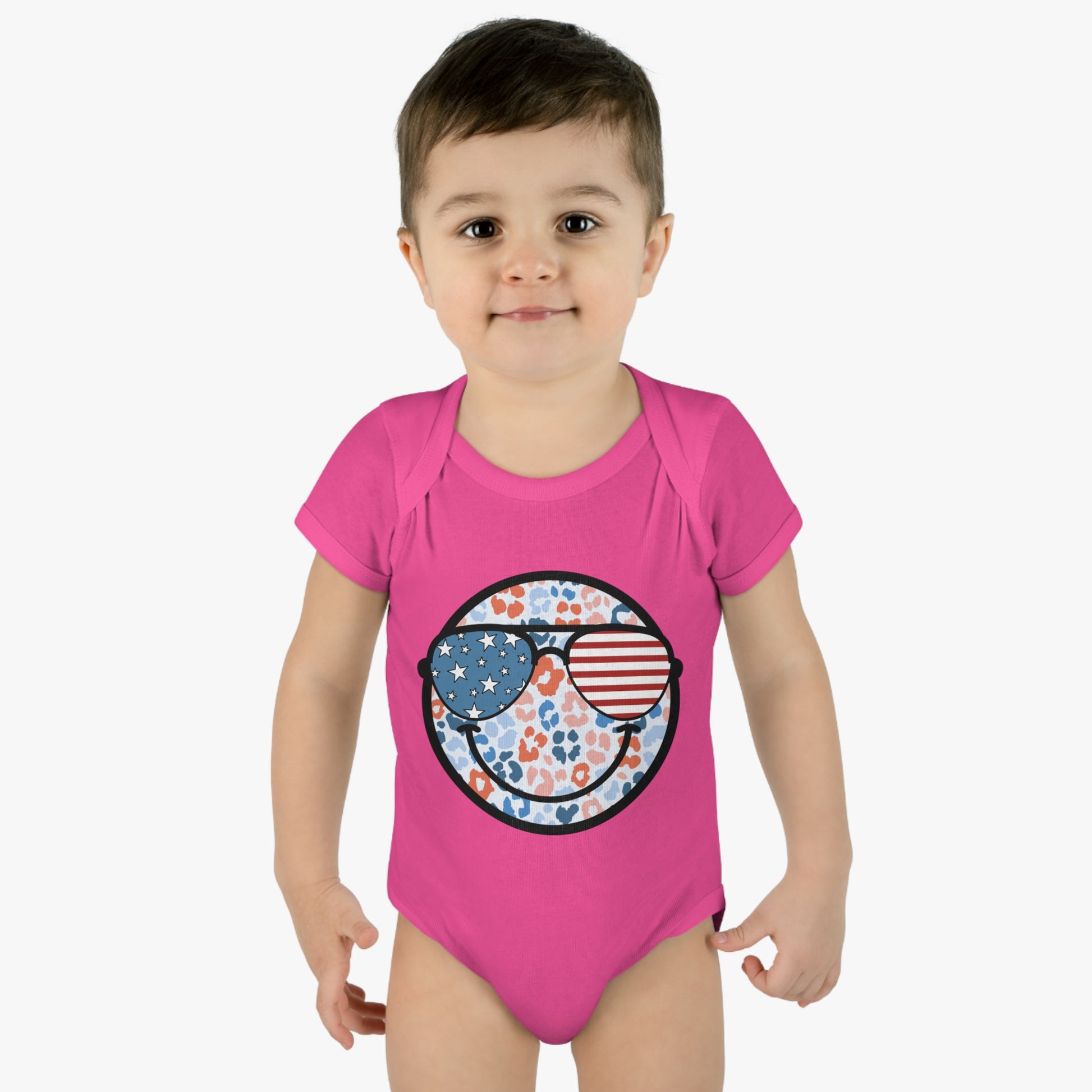 Retro Smiley Face Sunglasses Onesie featuring Patriotic 'Let Freedom Ring' design for Fourth of July celebrations. Vintage style comfort colors t-shirt with smiling happy face and USA flag sunglasses.