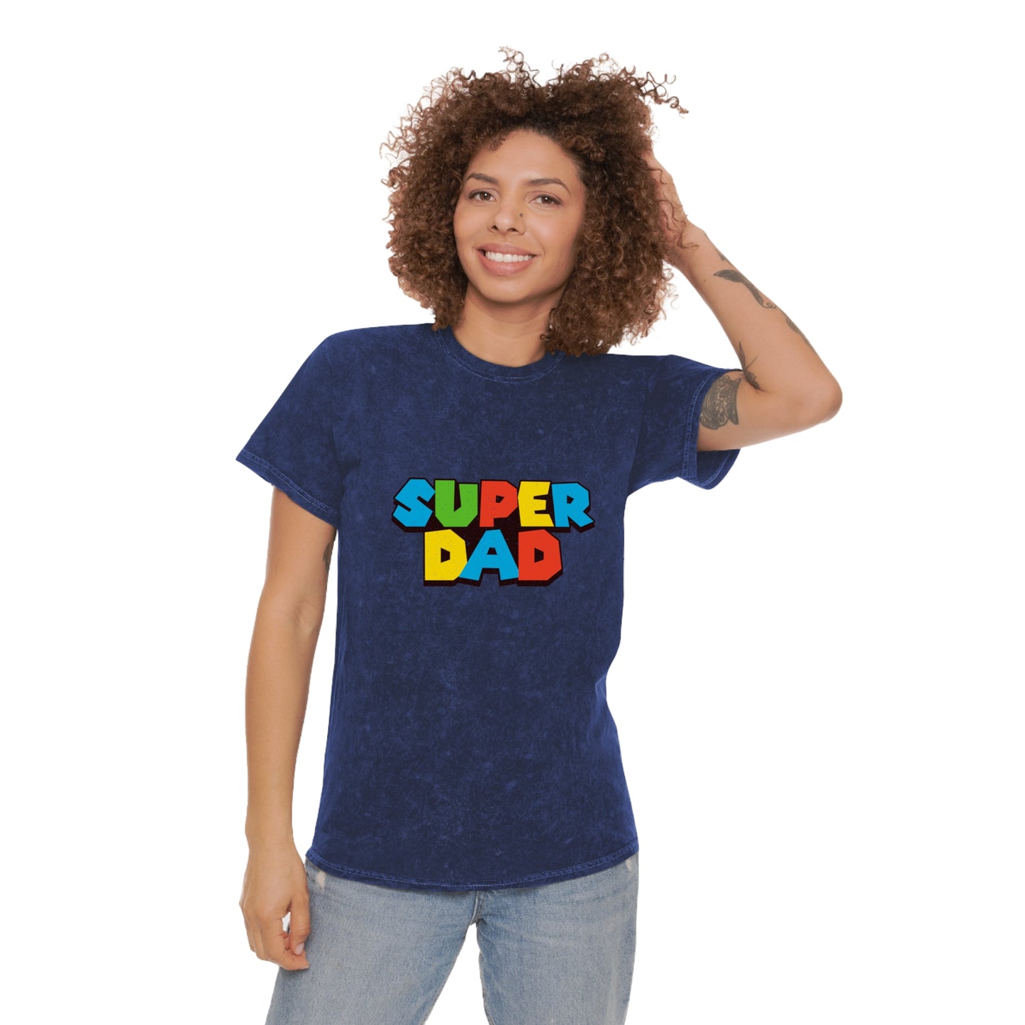 Super Mario-inspired retro 80s Father’s Day shirt for gamer dads. Soft 100% cotton with a nostalgic mineral wash effect, featuring a classic crewneck and 'SUPER DAD' graphic in colorful block letters. Available in black, gray, navy, and purple, men’s sizes small to 2XL. Perfect geeky dad gift for birthdays or Father’s Day.