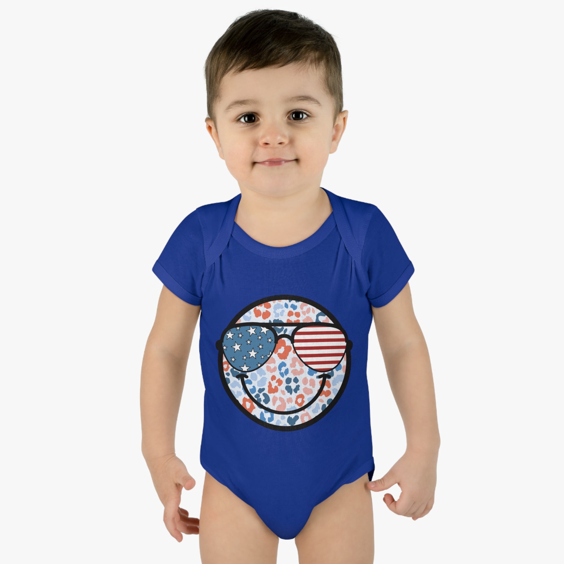 Retro Smiley Face Sunglasses Onesie featuring Patriotic 'Let Freedom Ring' design for Fourth of July celebrations. Vintage style comfort colors t-shirt with smiling happy face and USA flag sunglasses.