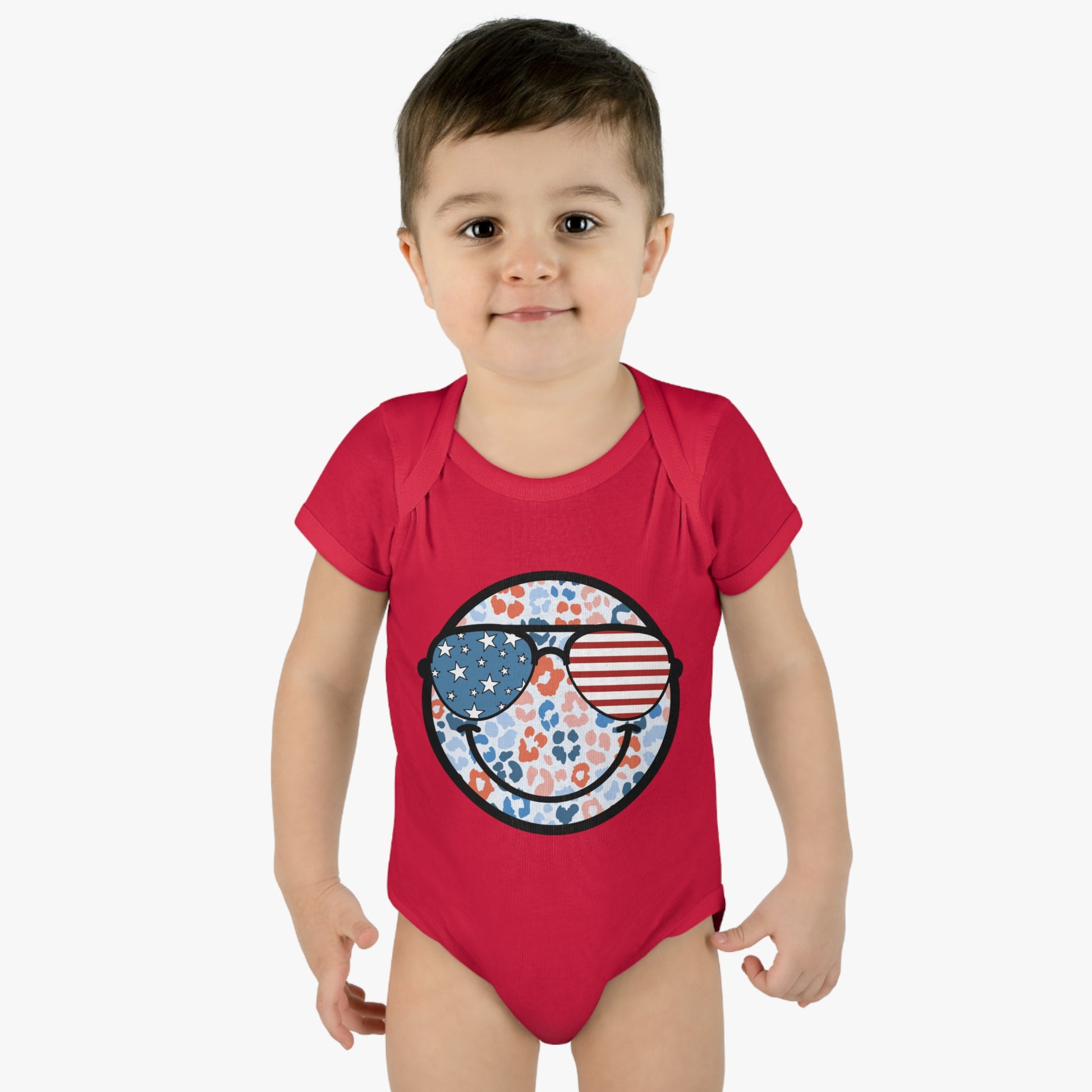 Retro Smiley Face Sunglasses Onesie featuring Patriotic 'Let Freedom Ring' design for Fourth of July celebrations. Vintage style comfort colors t-shirt with smiling happy face and USA flag sunglasses.