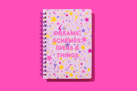 Hardcover notebook with motivational phrase, stars pattern, perforated pages, purple binding.