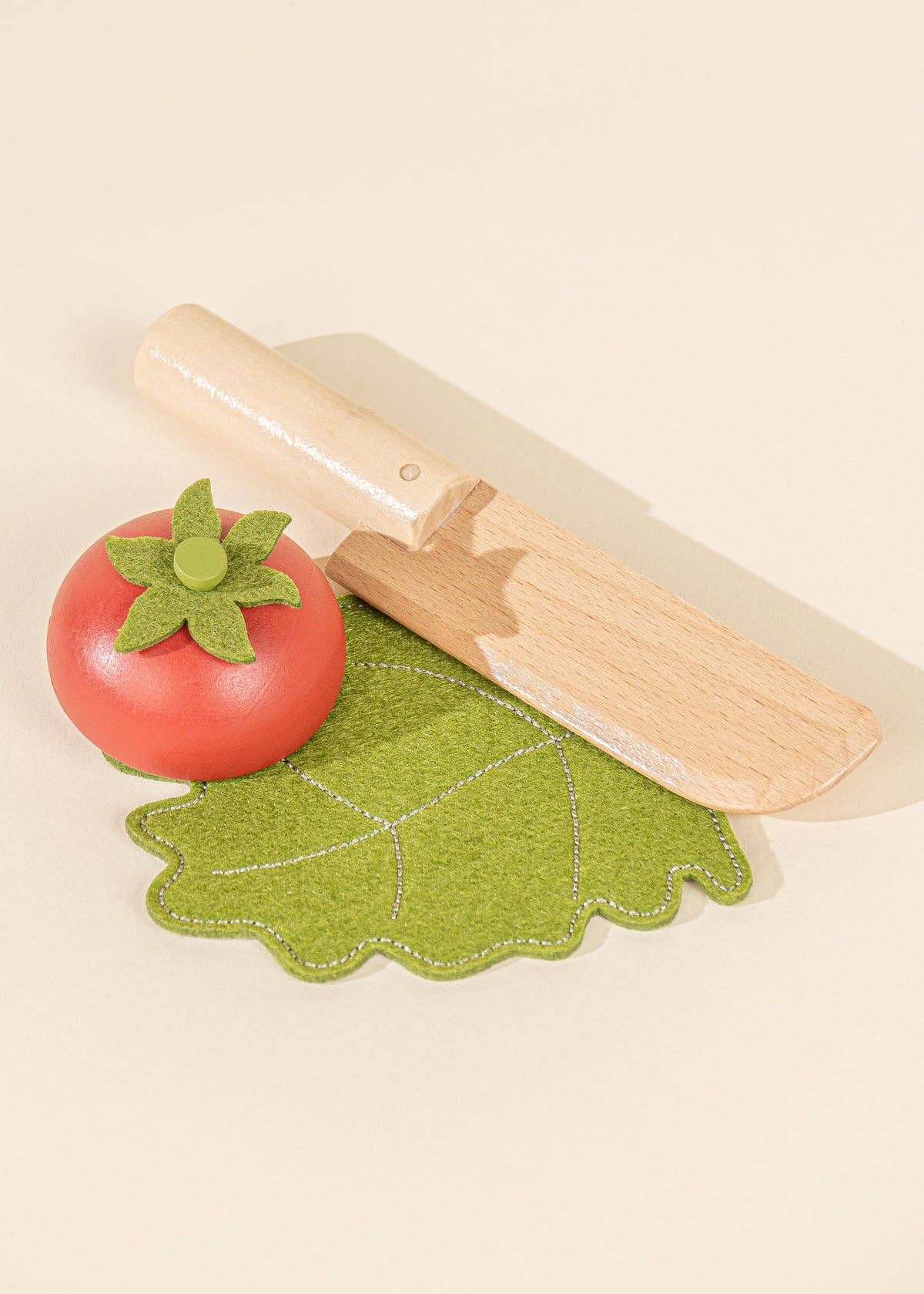 Market basket playset with wooden veggies and a knife, perfect for toddler pretend kitchen fun.