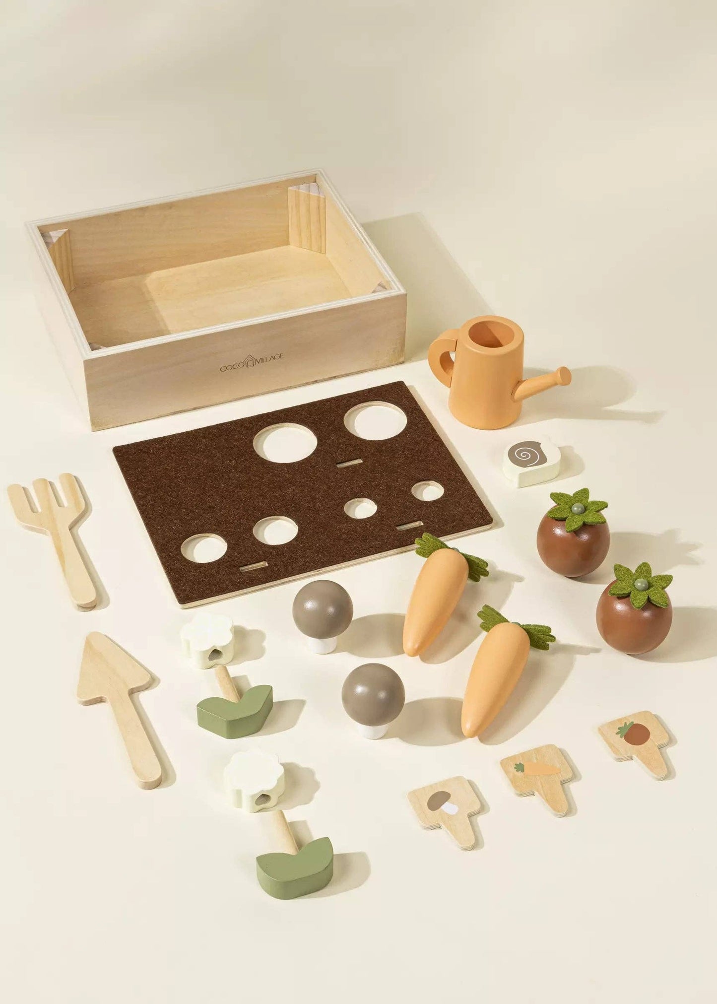 Wooden Garden Playset for kids with flowers, carrots, tomatoes, mushrooms, snail, gardening tools, watering can, and garden signs. Perfect for nature-inspired imaginative play, helping children learn about gardening while developing motor and social skills in a fun way.