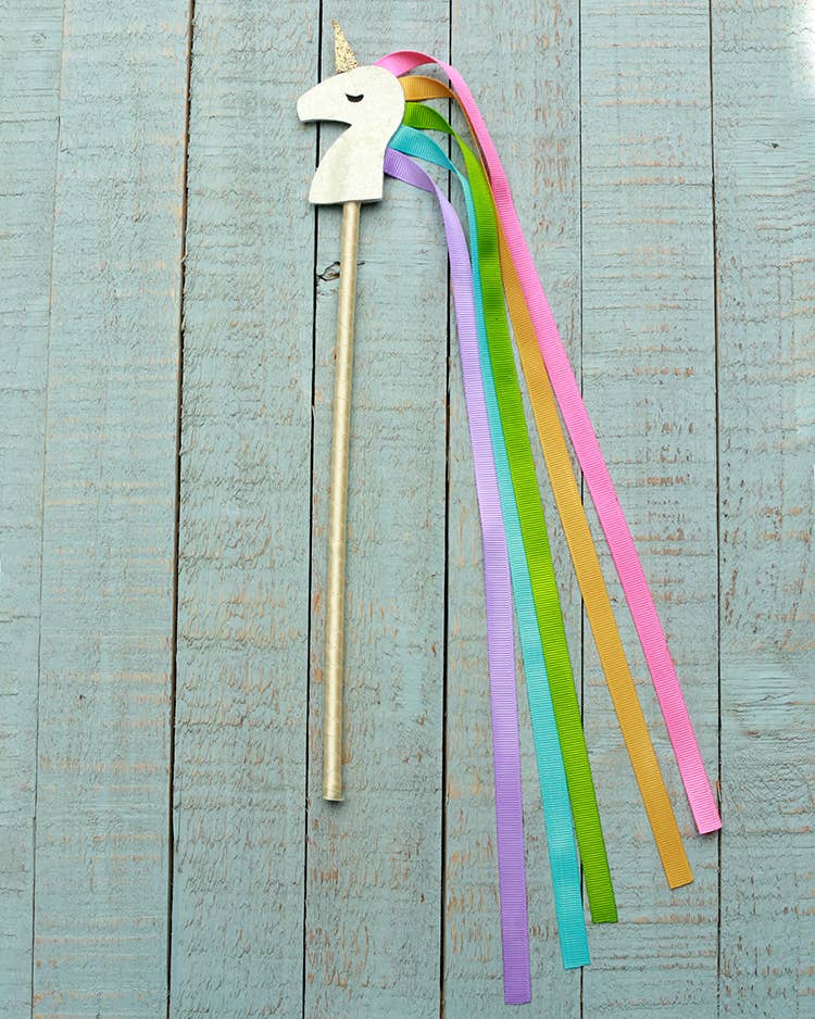 Unicorn Wand from Sparkle Sisters by Couture Clips featuring a glittering unicorn with grosgrain ribbon hair. This enchanting toy wand inspires imaginative play, making it perfect for dress-up and creative adventures for kids. The sparkling design and charming details encourage storytelling and fun, making it an ideal gift for young dreamers.