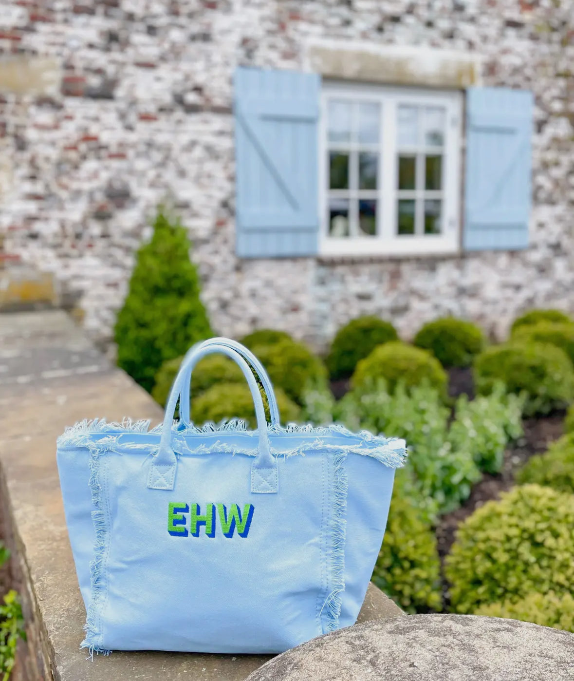 Stylish On the Fringe Tote featuring playful fringe detailing for a fun, fashionable look. Made with high-quality materials, this tote is perfect for spring break, adding a trendy touch to any outfit