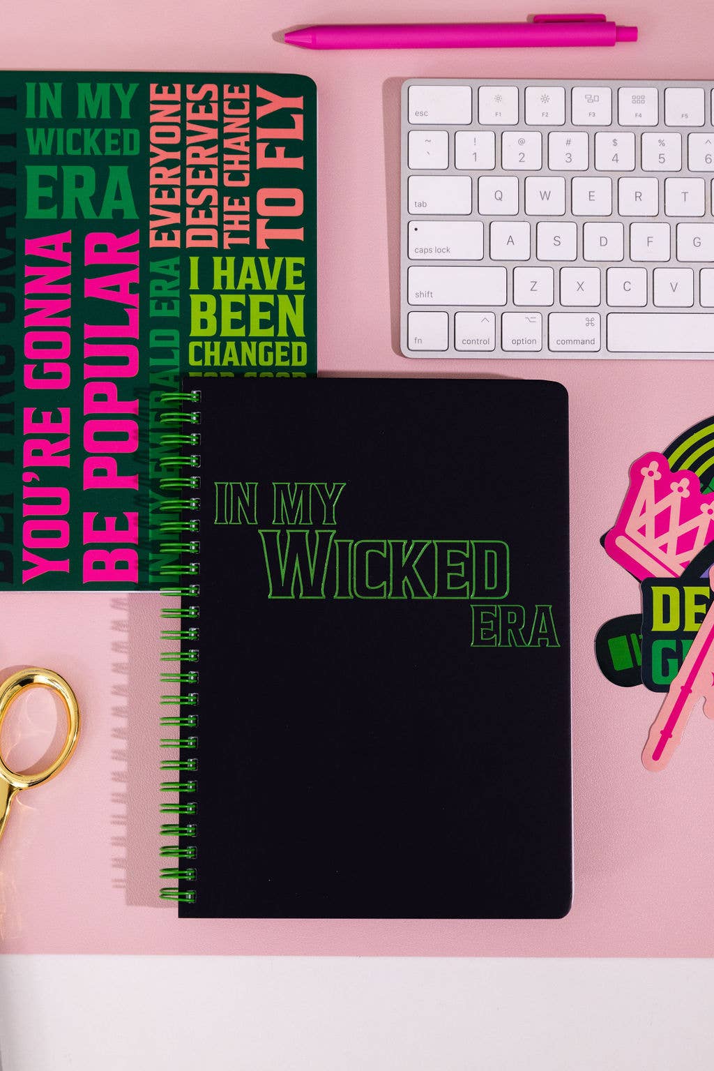 Wicked-inspired mini notebook with 160 college-ruled pages, durable hardcover, and convenient pockets.