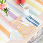 Bunny-shaped plates with gingham bandanas and gold foil accents, pack of 8, 10.5x7.5 inches; ideal for spring celebrations, 4 colors, 2 of each.