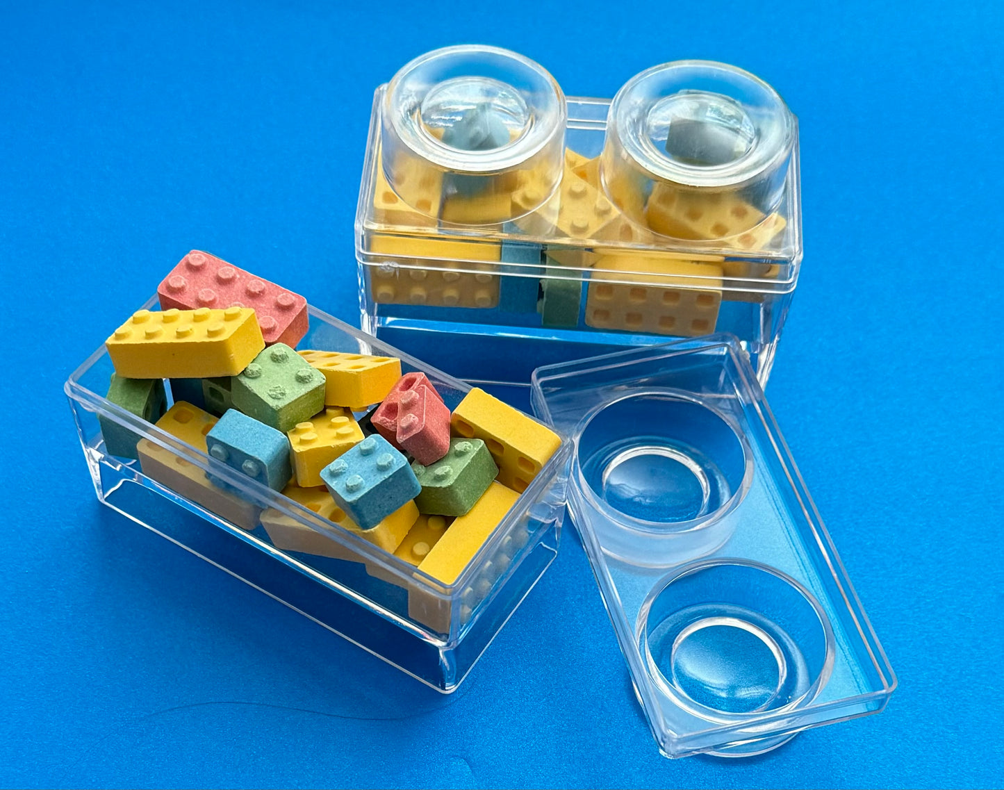 Block-themed candy favor in a brick-shaped box, perfect for birthday parties or playdates. Includes Lego-themed candies with optional cellophane wrap and thank you label. Custom candy containers available upon request.