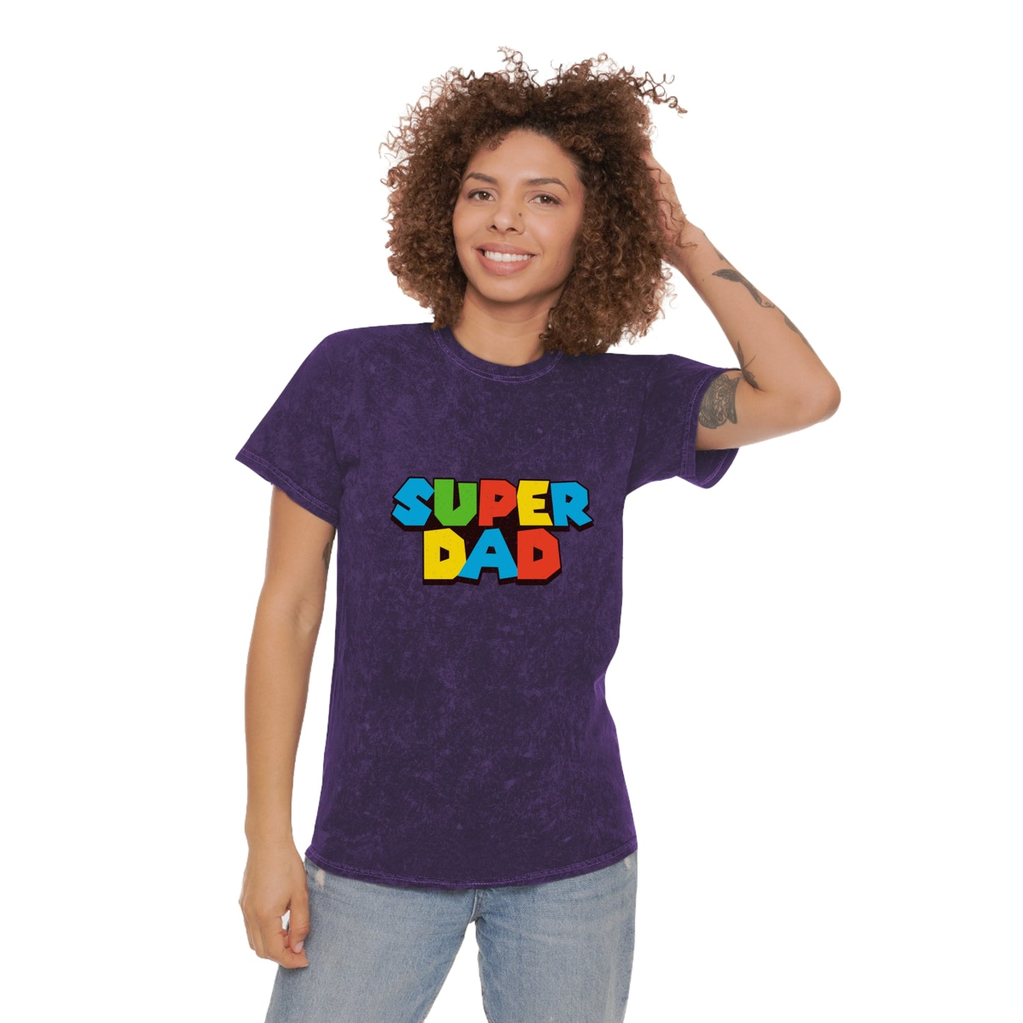 Super Mario-inspired retro 80s Father’s Day shirt for gamer dads. Soft 100% cotton with a nostalgic mineral wash effect, featuring a classic crewneck and 'SUPER DAD' graphic in colorful block letters. Available in black, gray, navy, and purple, men’s sizes small to 2XL. Perfect geeky dad gift for birthdays or Father’s Day.