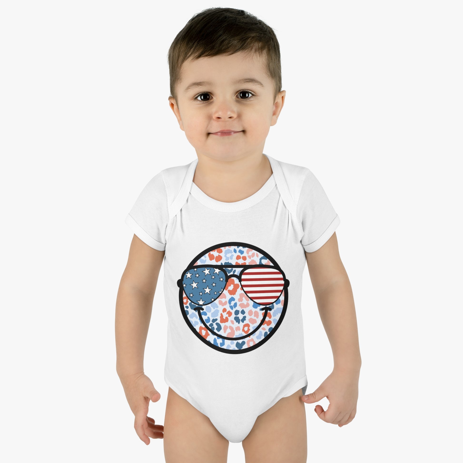 Retro Smiley Face Sunglasses Onesie featuring Patriotic 'Let Freedom Ring' design for Fourth of July celebrations. Vintage style comfort colors t-shirt with smiling happy face and USA flag sunglasses.