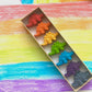 Eco-friendly dinosaur crayons gift set made from recycled materials, featuring 7 non-toxic crayons in assorted colors. Great for parties, holidays, and everyday fun!