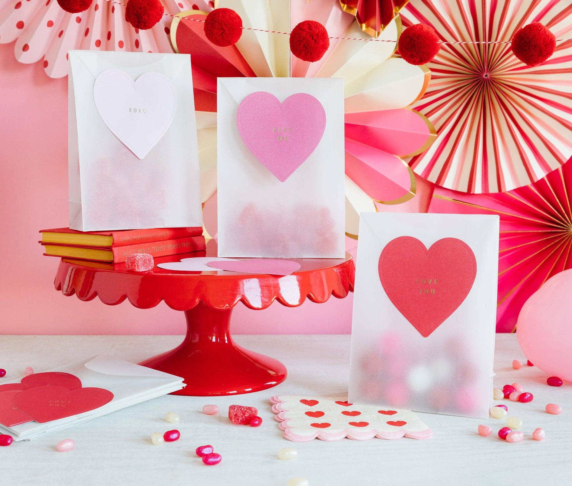 Valentine's Day glassine treat bags with heart-shaped stickers, perfect for gifting candy or small presents, includes 8 bags and 8 heart stickers.