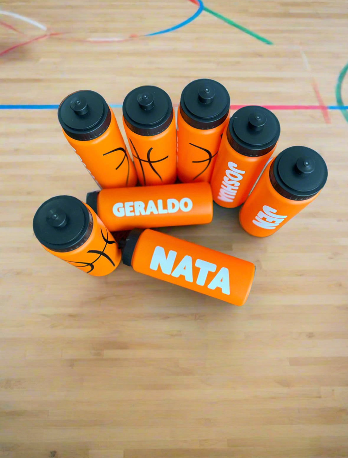 Custom sports water bottles for basketball, personalized with names. Features durable HDPE material, leak-proof pull-top cap, 20 oz capacity, and slim design. Ideal for sports events, school, and gifts. Available in custom colors and fonts.