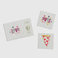 Valentine's Day temporary tattoos featuring neon colors and gold foil accents, illustrated by Jordan Sondler for Daydream Society. Package includes 2 safe, non-toxic tattoos, each measuring 2.5 inches square, packaged in a cardstock envelope. Perfect for party favors.