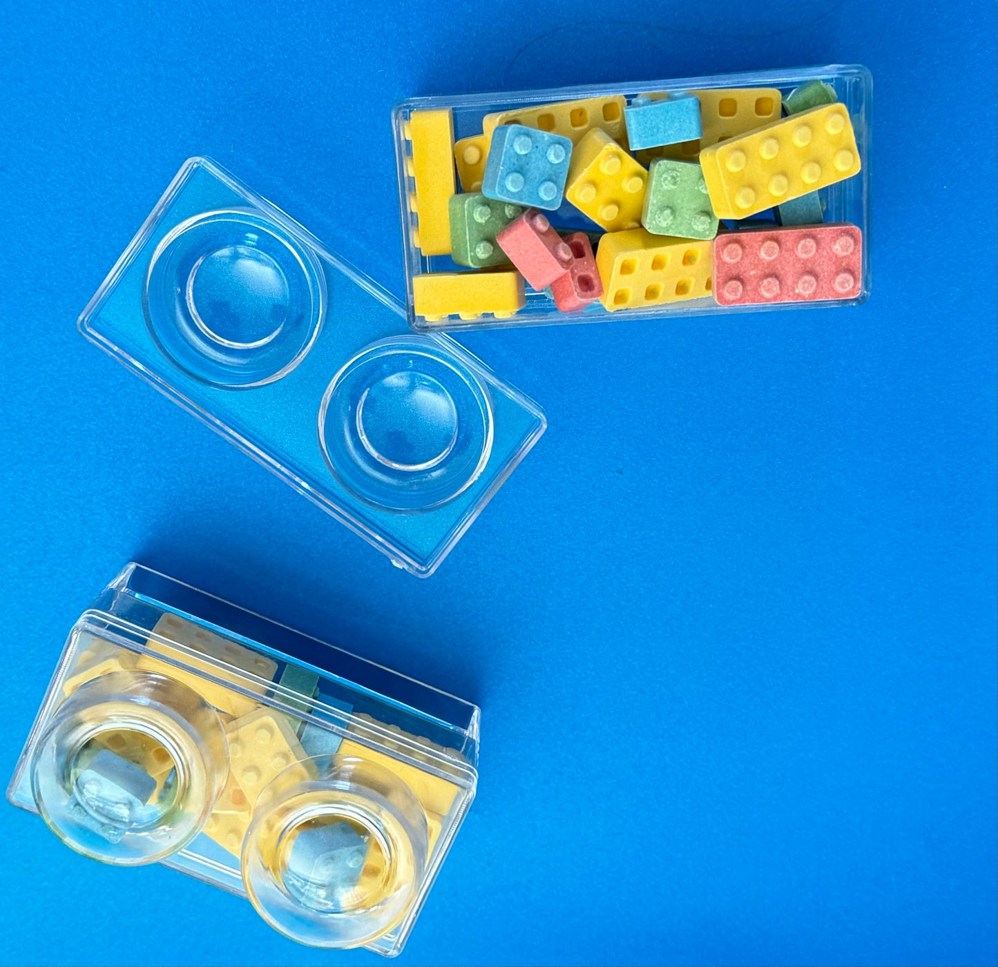 Block-themed candy favor in a brick-shaped box, perfect for birthday parties or playdates. Includes Lego-themed candies with optional cellophane wrap and thank you label. Custom candy containers available upon request.