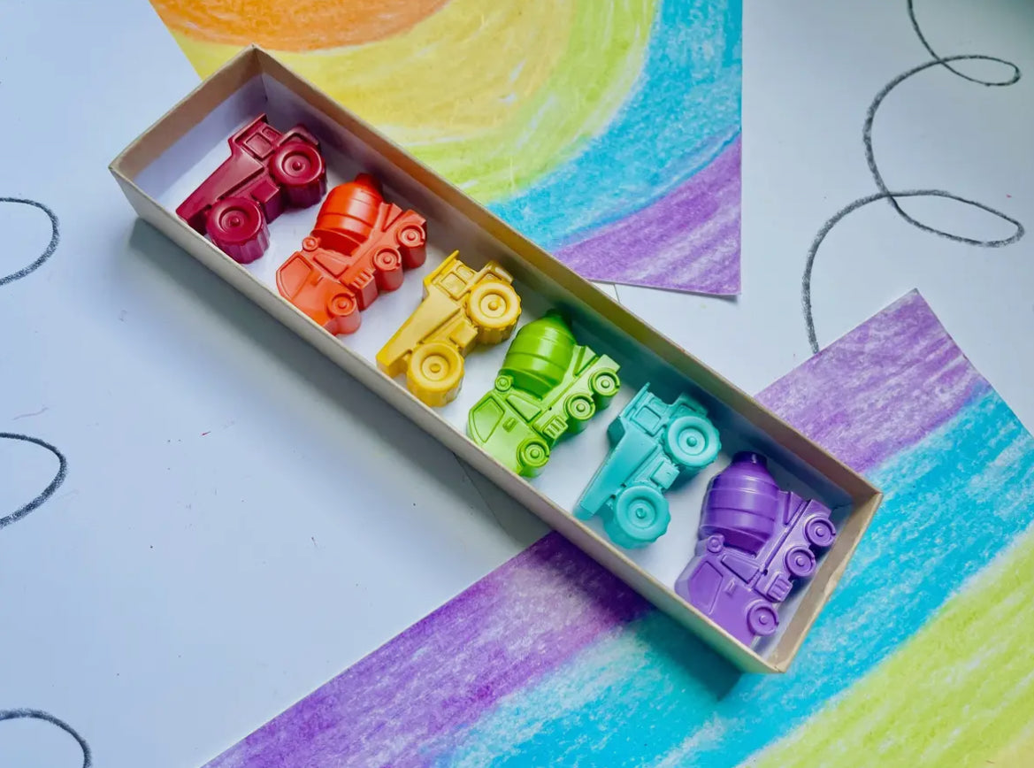 Construction-themed crayon gift set, made from 100% non-toxic materials. Perfect for stocking stuffers, party favors, or classroom gifts. Each set includes 7 crayons in assorted colors, packaged in an 8" x 2" box. Crayons measure approx. 2" x 1" x 0.75". Recycled and upcycled!