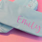 Personalized cosmetic pouch with zipper, featuring custom name, initials, or trendy icons. Lightweight and durable, available in neon or neutral colors with gold zippers. Size: 10" long x 5" wide x 3" deep. Perfect for summer slumber parties, travel, school, or as a makeup organizer. Great gift for girls, bridesmaids, or team members.