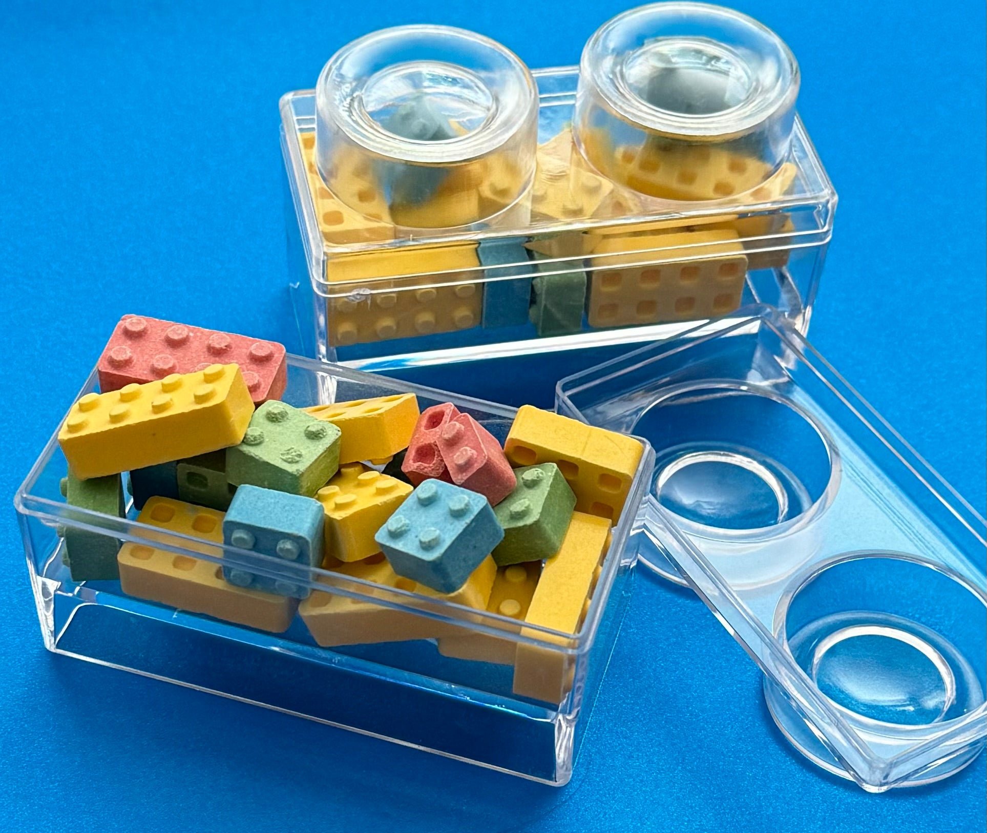 Block-themed candy favor in a brick-shaped box, perfect for birthday parties or playdates. Includes Lego-themed candies with optional cellophane wrap and thank you label. Custom candy containers available upon request.