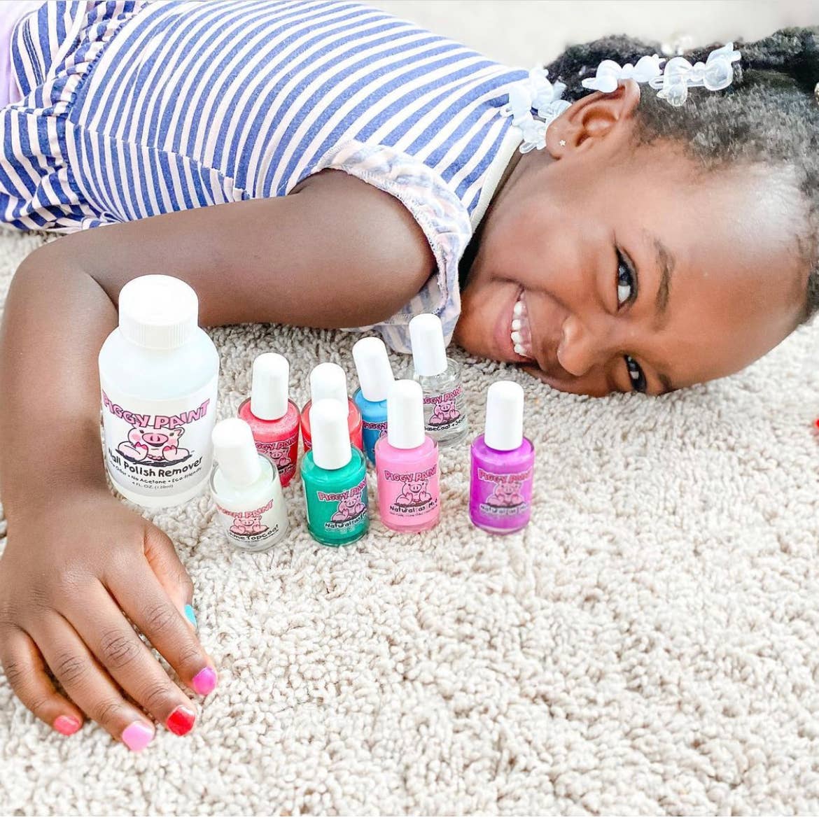 Water-based, non-toxic Piggy Paint nail polish, perfect for kids and safe for pregnancy, featuring a cruelty-free and vegan formula that dries hard and doesn’t peel, offering fun and vibrant colors.