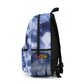 Personalized tie-dye backpack for kids, customizable with initials or name. Featuring a blue tie-dye swirl pattern, this trendy and durable bag includes a water bottle holder, zippered front pocket, and adjustable straps, making it perfect for school or camp.