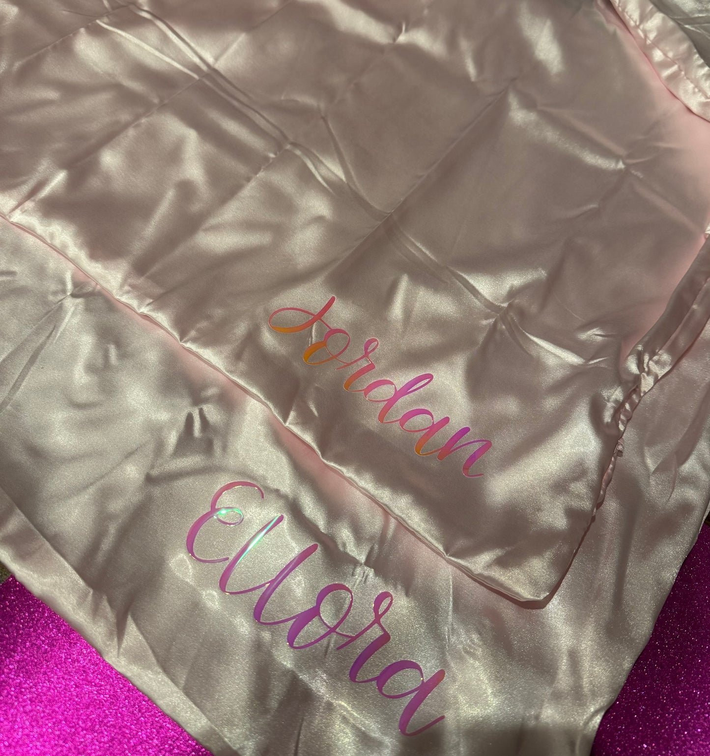 Personalized satin pillowcase made from soft microfiber fabric, perfect for reducing facial creases and wrinkles. Comes in a satin pouch for easy storage.