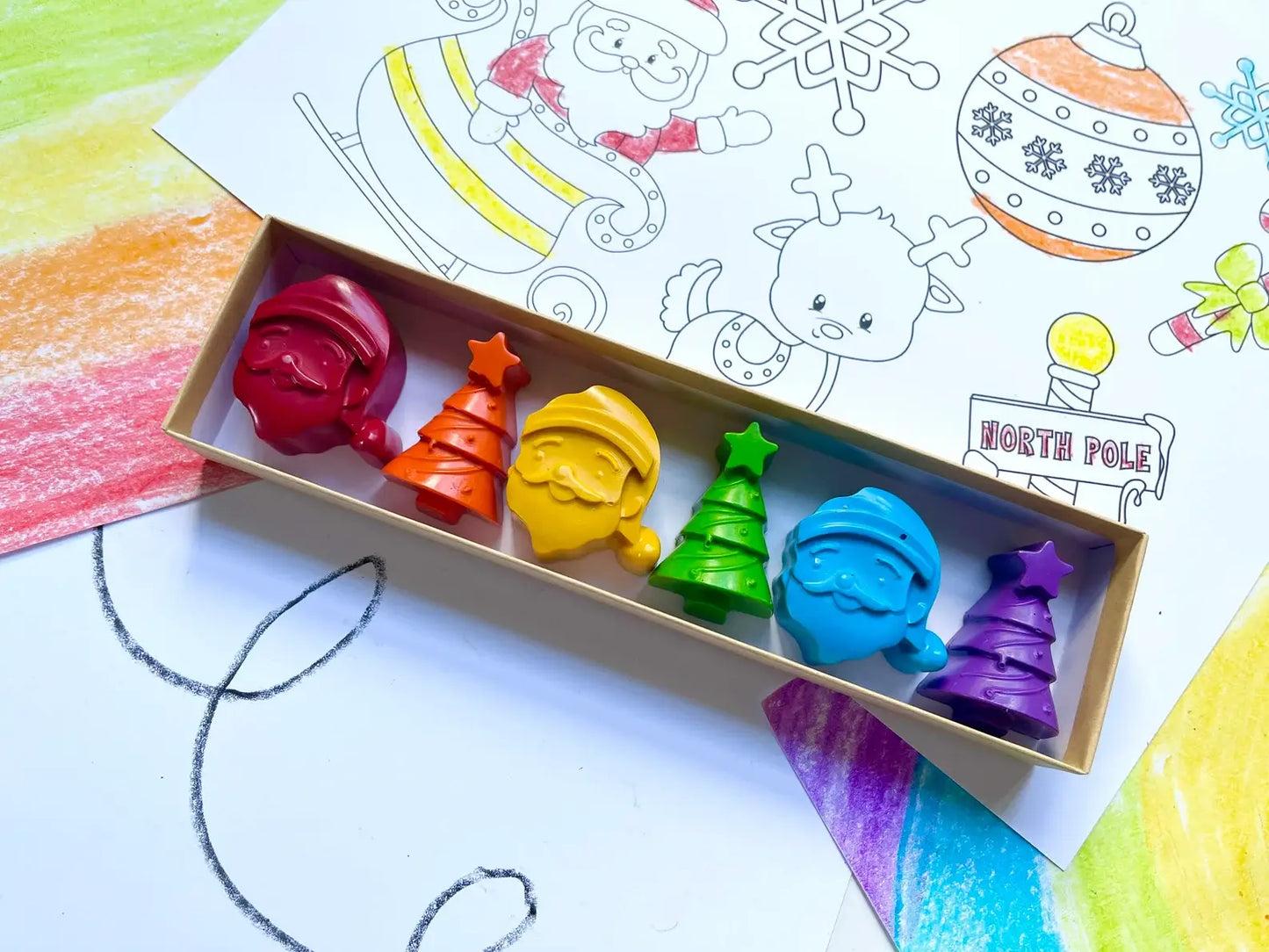 Santa Crayon Gift Set featuring 100% non-toxic holiday-themed crayons in festive shapes for stocking stuffers and party favors, packaged in a gift box.