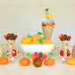 Handcrafted TOPS Malibu Surprize Cones with vintage-inspired toys, sweets, gems, and interactive surprises. Perfect as Thanksgiving hostess gifts, party favors, or table decor. Made in the USA for adults and kids over 3.