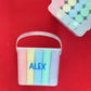 Personalized chalk bucket with 20 pieces of non-toxic chalk, featuring a handle and optional chalk holder. Ideal for outdoor fun or classrooms, easy to clean with water. Includes custom label and wrapping. Perfect for party favors or gifts.