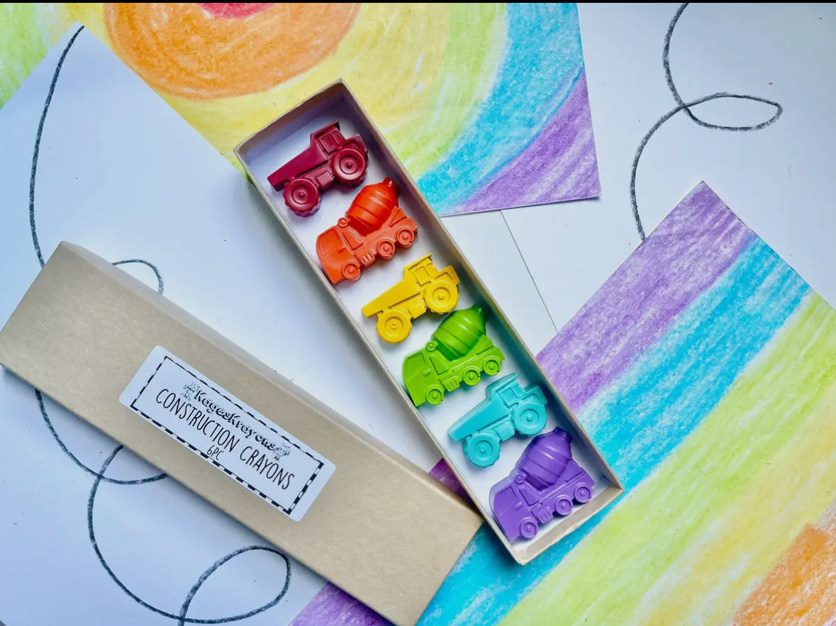 Construction-themed crayon gift set, made from 100% non-toxic materials. Perfect for stocking stuffers, party favors, or classroom gifts. Each set includes 7 crayons in assorted colors, packaged in an 8" x 2" box. Crayons measure approx. 2" x 1" x 0.75". Recycled and upcycled!