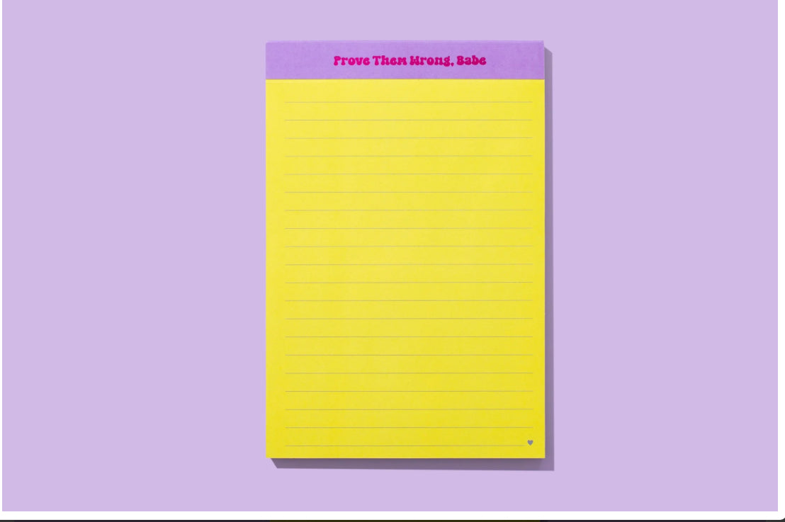 Yellow lined notepad with the motivational phrase 'Prove Them Wrong, Babe' printed in purple at the top. Designed for note-taking and empowering personal messages.