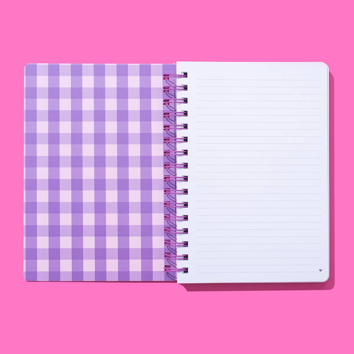 Hardcover notebook with motivational phrase, stars pattern, perforated pages, purple binding.