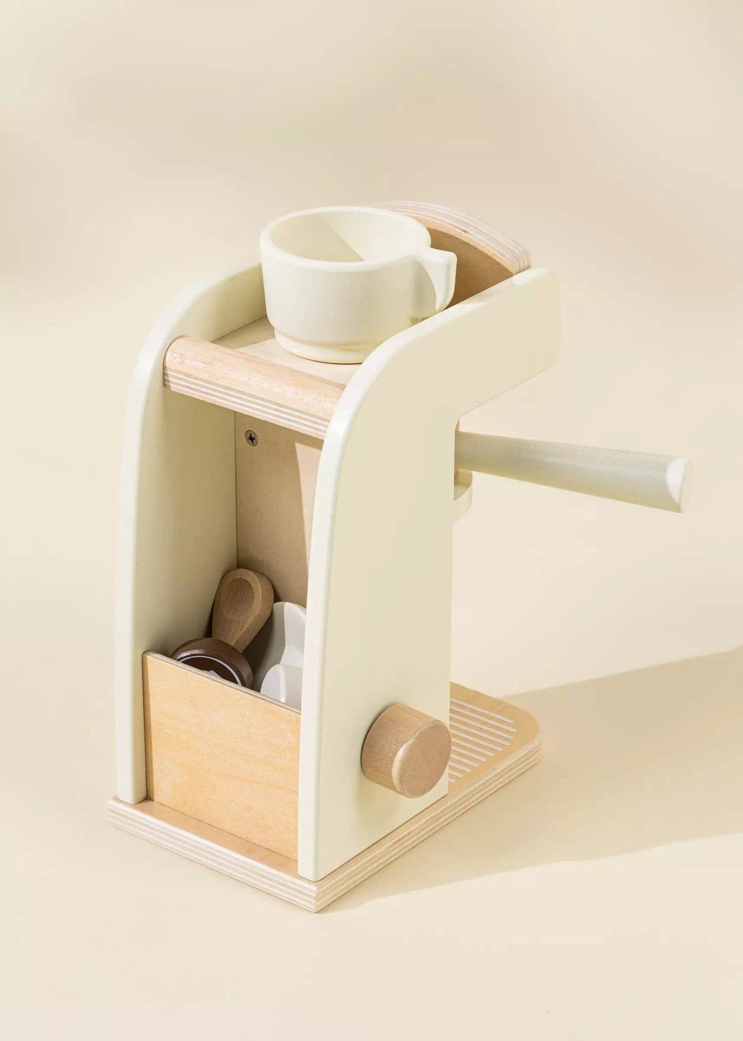 Wooden Coffee Maker Playset for kids with 4 coffee pods, cup, plate, spoon, cup holder, and 2 to-go cups. Perfect for imaginative play, allowing children to role-play as baristas, creating cappuccinos, lattes, and more. Encourages creativity and motor skills development.