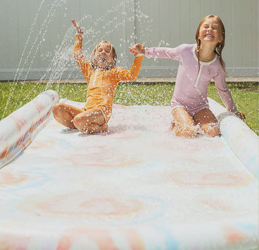 Colorful Tie Dye Slip, Slide, and Body Board Set designed for water fun in the sun, featuring easy hose connections and a repair patch for durability.