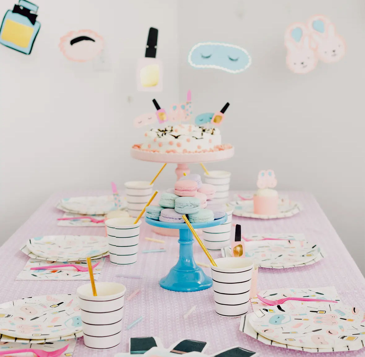 Slumber party nail polish bottle-shaped napkins with neon accents, perfect for sleepover and spa-themed parties. Illustrated by Hello!Lucky for Daydream Society. Includes 16 napkins, 4 of each color, measuring 6.5 inches wide by 8.25 inches tall. Not microwave safe.