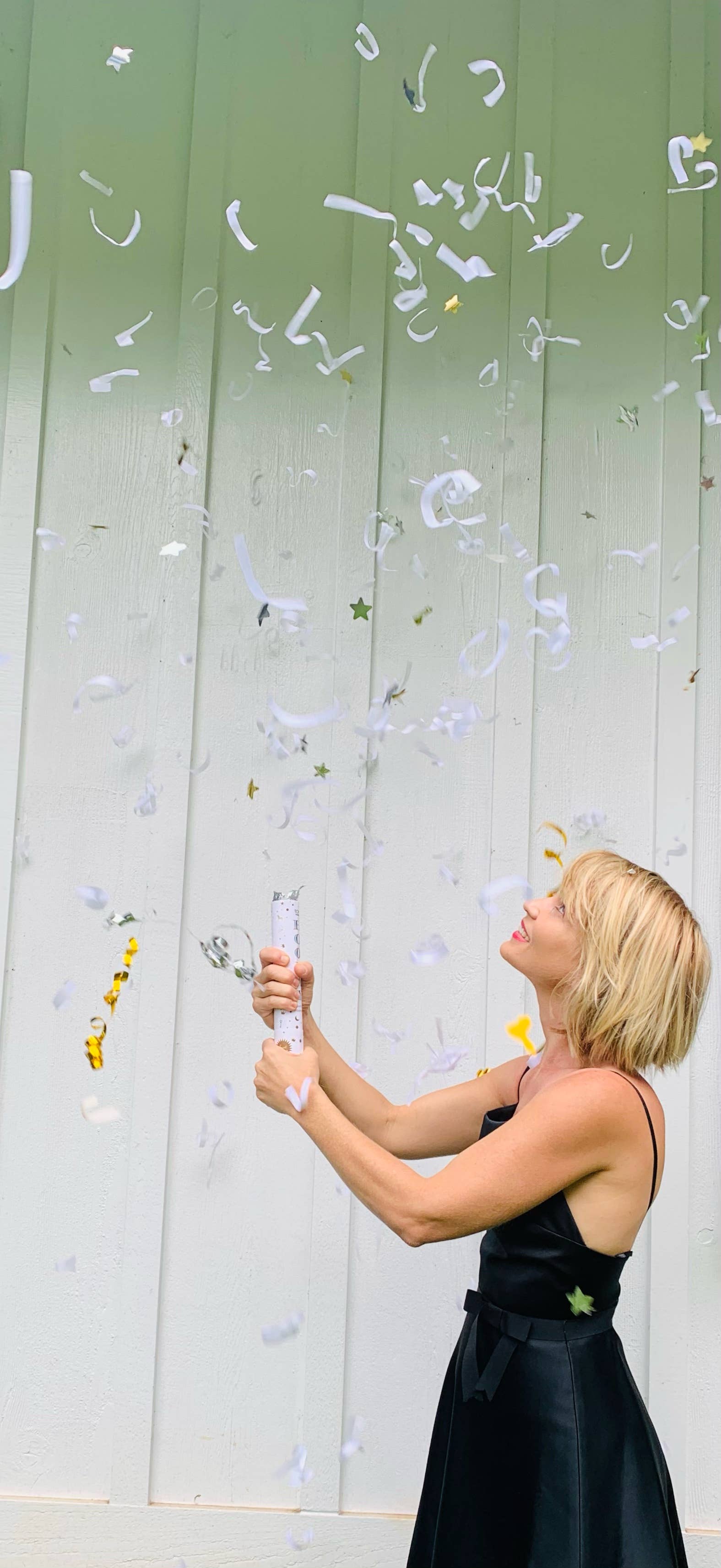 TOPS Malibu Confetti Fountain with vibrant butterflies, hearts, stars, and streamers, bursting up to 15 feet with a pop for festive celebrations.