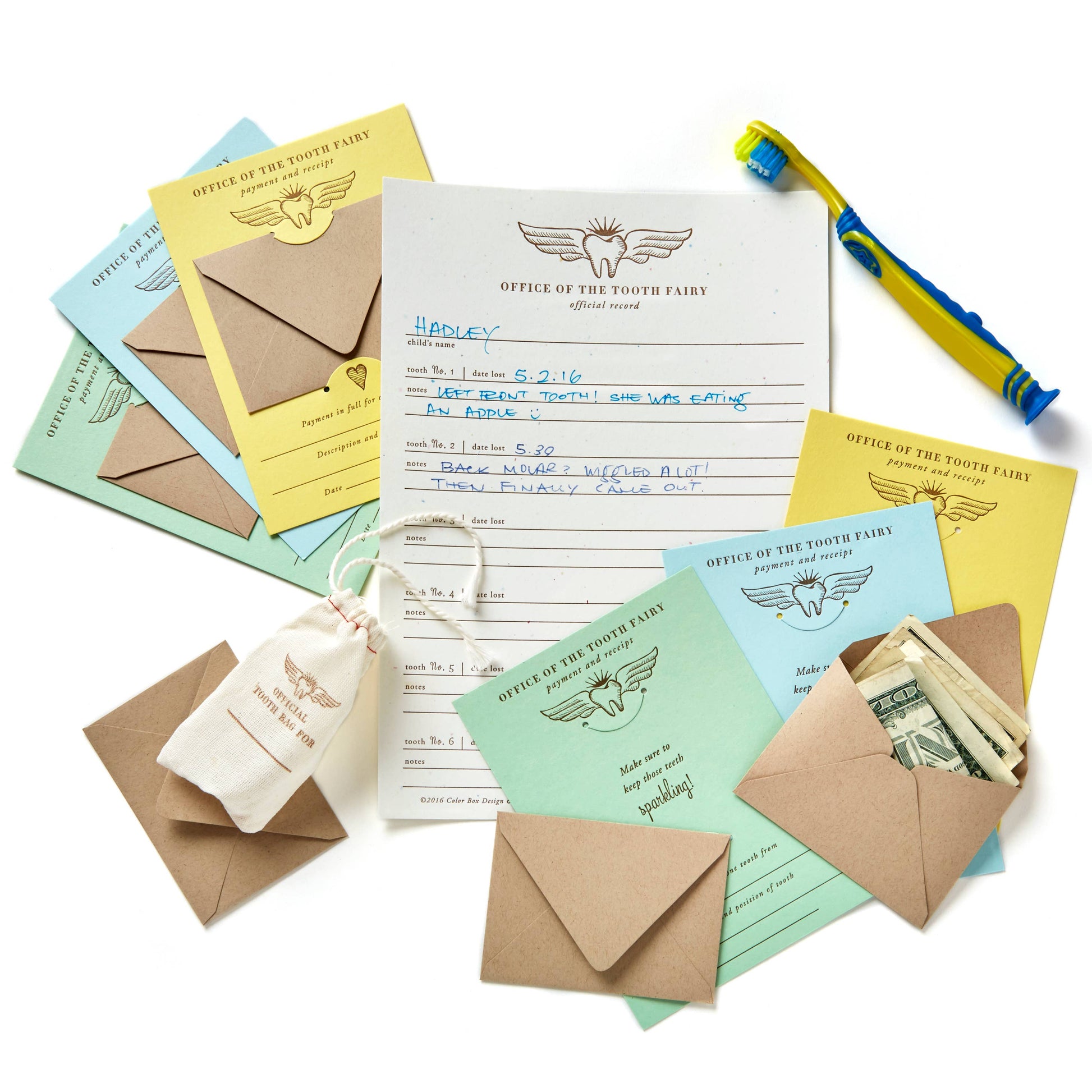 Official Tooth Fairy Kit with letterpress receipt cards, muslin bag, and record sheet for tooth loss. Includes 6 colorful receipts, payment envelopes, and keepsake record. Adds magic to the tooth fairy tradition, packaged in a sealed cello sleeve.