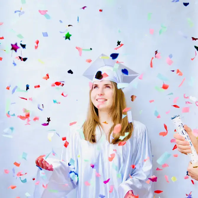 TOPS Malibu Confetti Fountain releasing colorful butterflies, hearts, stars, and streamers up to 20 feet with a pop for festive celebrations.