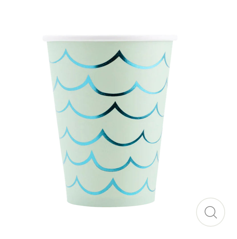 Mermaid Tail Paper Party Cups with adhesive tail and aqua foil accents, perfect for under-the-sea themed celebrations. Includes 8 cups per package, 12 oz capacity, measuring 4.5" tall and 3.5" round at the top