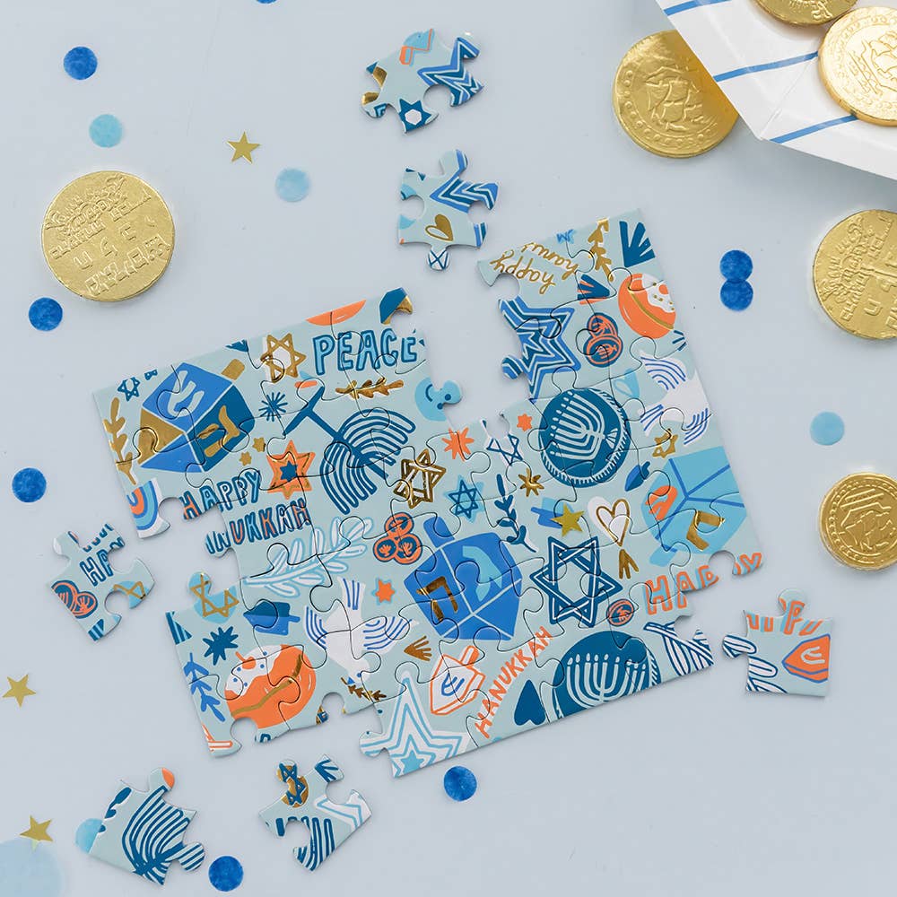 Mini Hanukkah puzzle with gold and silver foil accents, 42 pieces, 6.7x5.5 inches; festive design by Jordan Sondler, perfect for gifts or party favors."