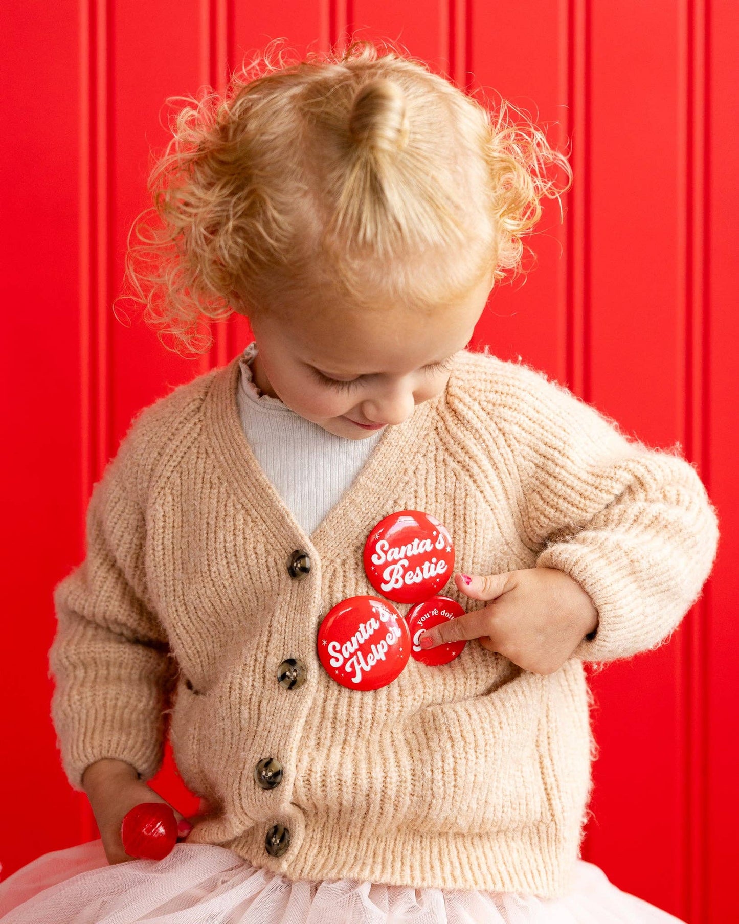 Adorable Elf Buttons and Mini Felt Pennant Set featuring three 1" buttons, two 1.5" buttons, two 2" buttons, and a 4"x3" pennant, perfect for adding a playful touch to Christmas decorations.